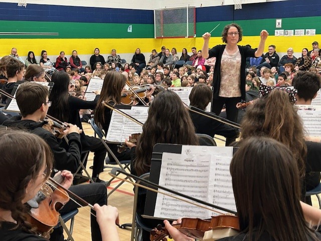 Band and Orchestra student playing their instruments
